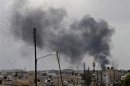 Smoke rises after an air strike on the city of Aleppo