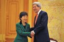 South Korean President Park and U.S. Secretary of State Kerry shake hands before their talks at the presidential Blue House in Seoul