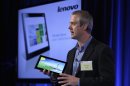 Tom Butler, Director of Lenovo ThinkPad Marketing, speaks while holding a Lenovo tablet Thursday, Sept. 27, 2012, in San Francisco. Intel previewed a wave of tablet computers powered by a microprocessor that the company redesigned to make a bigger dent in the rapidly growing mobile market. An assortment of major computer vendor made the tablets previewed Thursday in San Francisco. All the devices depend on Intel Corp.'s new processor and Windows 8, a dramatic overhaul of the widely used operating system made by Microsoft Corp. (AP Photo/Ben Margot)