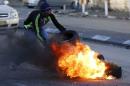 Palestinians clash with Israeli border police during clashes at a checkpoint between Shuafat refugee camp and Jerusalem