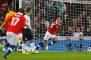 Chile's forward Alexis Sanchez (R) celebrates scoring the opening goal during an international friendly football match against England at Wembley in north London on November 15, 2013