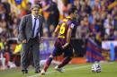 Barcelona's coach Gerardo Martino of;;owe the action from the side line during the final of the Copa del Rey between FC Barcelona and Real Madrid at the Mestalla stadium in Valencia, Spain, Wednesday, April 16, 2014. (AP Photo/Manu Fernandez)