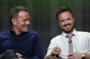 Cranston smiles with Paul at a panel for the television series "Breaking Bad" during the AMC portion of the Television Critics Association Summer press tour in Beverly Hills