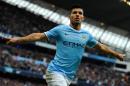 Manchester City's Argentinian forward Sergio Aguero celebrates after scoring against Arsenal at the Etihad Stadium in Manchester on December 14, 2013