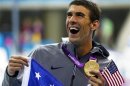 Michael Phelps of the U.S. holds his 19th Olympic medal presented to him in the men's 4x200m freestyle relay victory ceremony during the London 2012 Olympic Games at the Aquatics Centre