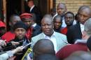 South African Economic Freedom Fighters party leader Julius Malema (C) addresses the media outside the North Gauteng High Court in Pretoria on August 25, 2014