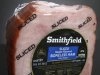 In this June 14, 2011 photo, a  package of Smithfield Sliced Maple Flavor Boneless Ham, is posed, in Montpelier, Vt. Smithfield Foods Inc. said Thursday, Dec. 8, 2011, its fiscal second-quarter net income slid 16 percent compared with last year's quarter, when some market factors helped the pork producer firm up its prices. (AP Photo/Toby Talbot)
