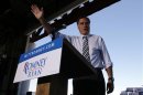 Republican presidential nominee Mitt Romney waves to the crowd at a campaign rally in Tampa