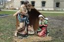 A nativity scene is displayed on the State House grounds in Lansing, Mich., Friday, Dec. 19, 2014. About 50 people sang Christmas carols and prayed to welcome the temporary nativity scene to the Capitol in a scene that likely wouldn't have happened were it not for a group of Satanists from Detroit. The three statues of the infant Jesus Christ and his parents, Mary and Joseph, stand about three feet tall in a small wooden manger were placed just south of the east steps of the Capitol. The display was celebrated by speakers at a brief ceremony as not only a symbol of the season but of a symbol of the right to celebrate that season. (AP Photo/David Eggert)