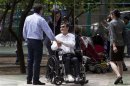 Blind Chinese dissident Chen takes a break in a city park in New York