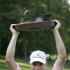 Zach Johnson holds the trophy after winning the John Deere Classic golf tournament at TPC Deere Run, Sunday, July 15, 2012, in Silvis, Ill.  Johnson defeated Troy Matteson in a playoff. (AP Photo/Charlie Neibergall)