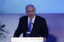 Israel's PM Netanyahu speaks during a farewell event for outgoing Defence Minister Barak at Bar-Ilan University near Tel Aviv