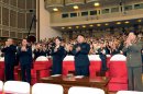 In this photo released by the Korean Central News Agency (KCNA) and distributed in Tokyo by the Korea News Service on Monday, July 9, 2012, North Korean leader Kim Jong Un, center right, and a woman clap with others as they watch performance by North Korea's new Moranbong band in Pyongyang, North Korea, Friday, July 6, 2012. The source did not identify the woman but South Korean media speculated that she could be Kim's younger sister or wife. (AP Photo/Korean Central News Agency via Korea News Service) JAPAN OUT UNTIL 14 DAYS AFTER THE DAY OF TRANSMISSION