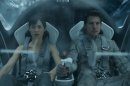 This film publicity image released by Universal Pictures shows Olga Kurylenko, left, and Tom Cruise in a scene from "Oblivion." (AP Photo/Universal Pictures)