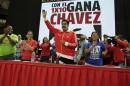 Venezuela's President Nicolas Maduro greets supporters as he arrives to a campaign rally with pro-government candidates for the upcoming parliamentary elections in Caracas