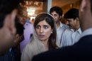 Pakistan's Foreign Minister Hina Rabbani Khar, talks to reporter after her press conference in Islamabad, Pakistan on Monday, May 14, 2012. Khar indicated Monday the time has come to reopen the country's Afghan border to NATO troop supplies, saying the government has made its point by closing the route for nearly six months in retaliation for a deadly U.S. attack on its troops. (AP Photo/Anjum Naveed)