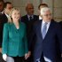 US Secretary of State Clinton walks with Palestinian President Abbas after their meeting in the West Bank city of Ramallah