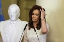FILE - In this Dec. 9, 2015 file photo, Argentina's President Cristina Fernandez gestures after unveiling a bust of her late husband, and former president, Nestor Kirchner, at the presidential palace in Buenos Aires, Argentina. Voters in Argentina elected a conservative businessman president over Fernandez's chosen successor. (AP Photo/Ricardo Mazalan, File)