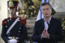 Argentine President Mauricio Macri gestures as he delivers a speech at Casa Rosada Government Palace in Buenos Aires on April 7, 2016, after a prosecutor opened an investigation on his offshore financial dealings leaked in the Panama Papers