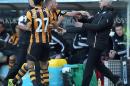 Newcastle United's manager Alan Pardew, right, and Hull City's David Meyler, 3rd left, confront each other during the during the English Premier League match at the KC Stadium, Hull England Saturday March 1, 2014. (AP Photo/Lynne Cameron/PA) UNITED KINGDOM OUT