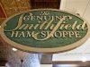 A sign advertising Smithfield hams hangs at the Taste of Smithfield restaurant and gourmet market in Smithfield, Virginia