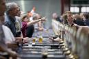 Visitors order their drink at a bar during the opening day of the Great British Beer Festival, organised by the Campaign for Real Ale, in London on August 12, 2014
