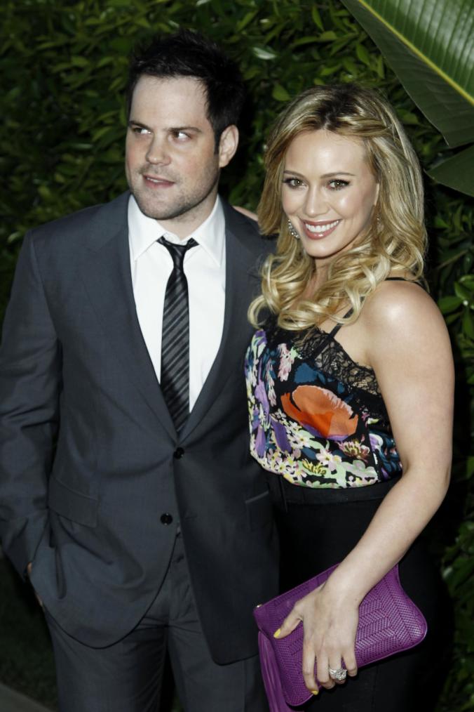 FILE - In this May 11, 2011 file photo, Hilary Duff, right, and Mike Comrie arrive at an Evening of &quot;Southern Style&quot; presented by The St. Bernard Project and the Spears Family in Beverly Hills, Calif.  Duff and her husband Comrie are calling it quits after three years or marriage according to Duff&#39;s reps. on Friday, Jan. 10, 2014. (AP Photo/Matt Sayles, File)