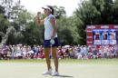 Lexi Thompson pumps her fist after winning the Meijer LPGA Classic golf tournament Sunday, July 26, 2015, in Belmont, Mich., one stroke ahead of Lizette Salas. (AP Photo/Carlos Osorio)