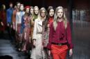 Models wear creations for Gucci women's Fall-Winter 2015-2016 collection, part of the Milan Fashion Week, unveiled in Milan, Italy, Wednesday, Feb. 25, 2015. (AP Photo/Antonio Calanni)
