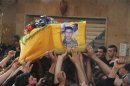 Supporters of Hezbollah and relatives of Hasan Faisal Sheker , an 18-year-old Hezbollah member, carry the coffin during his funeral in Nabi Sheet near Baalbeck