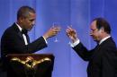 Obama and French President Hollande toast during State Dinner at the White House in Washington