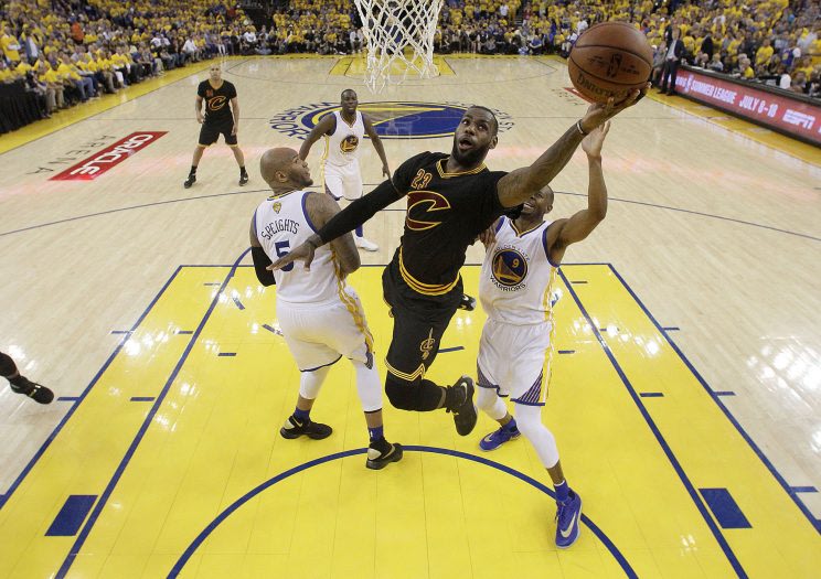 Cleveland Cavaliers forward LeBron James (23) shoots against the Golden State Warriors during the first half of Game 7 of basketball's NBA Finals in O...