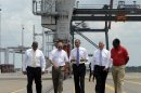 President Barack Obama, center, gets a tour of the Jacksonville, Fla. port with, from left, Transportation Secretary Anthony Foxx; Dennis Kelly, TracPac Regional Vice President and General Manager; Ray Schleicher, CEO of the Jacksonville Port Authority, and Fred Wakefield, International Longshoreman's Association Representative, during a tour, Thursday, July 25, 2013. A day after he kicked off the tour in Illinois and Missouri, Obama was traveling Thursday to a seaport in Jacksonville, Fla., to yet again deride the wide gulf between his vision for a new American prosperity driven by a burgeoning middle class and the intense gridlock snarling up Congress. (AP Photo/Susan Walsh)