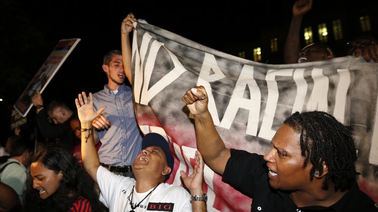 Demonstrators react after Zimmerman was found not guilty on second-degree murder and manslaughter charges in Sanford