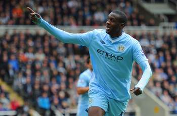 Unstoppable Yaya Toure drives Manchester City to within inches of the Premier League title