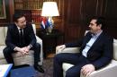 A spokesman for Eurogroup head Jeroen Dijsselbloem, seen in 2015 with Greek Prime Minister Alexis Tsipras, said the eurozone was suspending the recently announced debt relief scheme for Athens in retaliation at not being fully briefed on handout plans