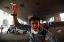File photo shows member of the Muslim Brotherhood and supporter of ousted Egyptian President Mohamed Mursi shouting slogans after he is injured in front Azbkya police station during clashes at Ramses Square in Cairo