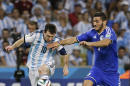 Bosnia's Sead Kolasinac, right, tries to stop Argentina's Lionel Messi (10) during their group F World Cup soccer match at the Maracana Stadium in Rio de Janeiro, Brazil, Sunday, June 15, 2014. (AP Photo/Thanassis Stavrakis)