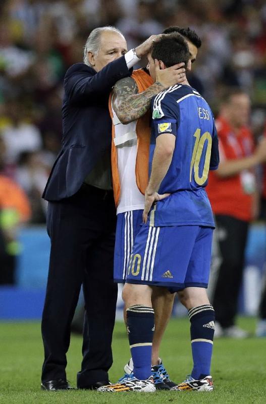 Argentina&#39;s head coach Alejandro Sabella, left, comforts Lionel Messi after the World Cup final soccer match between Germany and Argentina at the Maracana Stadium in Rio de Janeiro, Brazil, Sunday, July 13, 2014. Germany beat Argentina 1-0 to win its fourth World Cup title