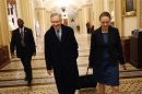 Reid departs with an aide after a senate vote in the early morning hours from the U.S. Capitol in Washington