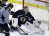 Boston Bruins goalie Tuukka Rask makes a pad save during practice at TD Garden in Boston, Monday, June 10, 2013. The Bruins are preparing to face the Chicago Blackhawks in the NHL hockey Stanley Cup finals with Game 1 scheduled for Wednesday in Chicago. (AP Photo/Elise Amendola)
