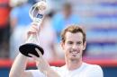 Andy Murray holds up the Rogers Cup after defeating Novak Djokovic 6-4, 4-6, 6-3 during day seven of the Rogers Cup on August 16, 2015 in Montreal