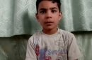 This image made from amateur video, released by the Houla Media Office and accessed Thursday, May 31, 2012 purports to show 11-year-old Ali el-Sayed, a survivor of the Houla massacre that began Friday and left 108 people dead, many of them children and women. Ali is one of the few survivors of the weekend massacre in Houla, a collection of poor farming villages and olive groves in Syria's central Homs province. More than 100 people were killed, many of them women and children who were shot or stabbed in their houses. (AP Photo/Shaam News Network via AP video) THE ASSOCIATED PRESS CANNOT INDEPENDENTLY VERIFY THE CONTENT, DATE, LOCATION OR AUTHENTICITY OF THIS MATERIAL
