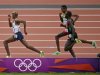 Britain's Mo Farah sprints for the finish ahead of Ethiopia's Dejen Gebremeskel and Kenya's Thomas Pkemei Longosiwa in the men's 5000m final at the London 2012 Olympic Games