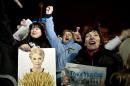 Opposition protesters cheer as newly freed Ukrainian opposition icon Yulia Tymoshenko delivers a speech during a rally at Independence Square in Kiev on February 22, 2014