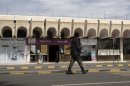 A policeman walks as he secures the Sanaa International Airport, in Yemen, Wednesday, Aug. 7, 2013. The State Department on Tuesday ordered non-essential personnel at the U.S. Embassy in Yemen to leave the country. The department said in a travel warning that it had ordered the departure of non-emergency U.S. government personnel from Yemen "due to the continued potential for terrorist attacks" and said U.S. citizens in Yemen should leave immediately because of an "extremely high" security threat level. (AP Photo/Hani Mohammed)