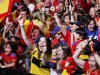 Spanish fans celebrate during the viewing of Euro 2012 soccer championship final match between Spain and Italy at the Fan Zone in Madrid, Spain, Sunday, July 1, 2012. (AP Photo/Andres Kudacki)