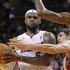 Miami Heat's LeBron James looks to pass as Milwaukee Bucks' Ilyasova and Sanders defend in the first half of their NBA basketball game in Miami, Florida