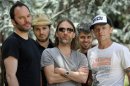 This May 22, 2013 photo shows members of Atoms For Peace , from left, Nigel Godrich, Joey Waronker, Thom Yorke, Mauro Refosco and Flea posing for a portrait in Los Angeles. The band's 27-date tour begins in July in Europe and will reach the US in September before ending in Japan. (Photo by Chris Pizzello/Invision/AP)