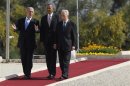 U.S. President Barack Obama walks with Israel's President Shimon Peres and Prime Minister Benjamin Netanyahu after laying a wreath at the grave of Theodor Herzl at Mt Herzl in Jerusalem